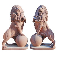 marble lion with ball statue
