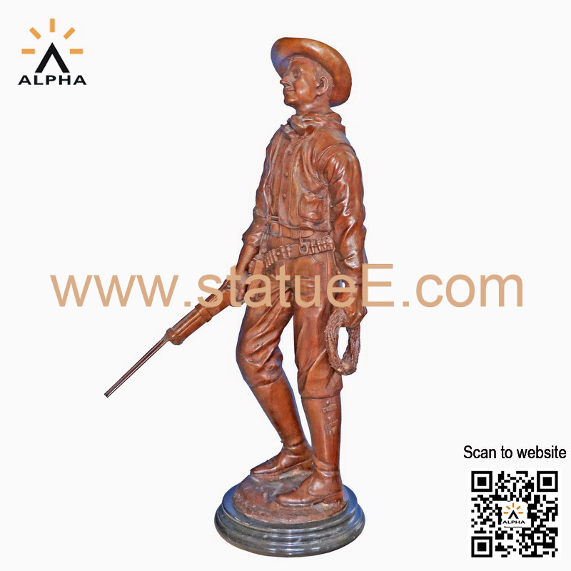 Bronze cowboy statue